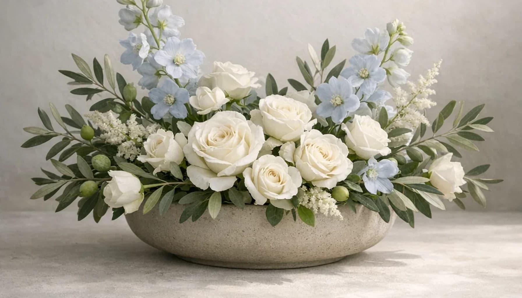International Day of Conscience flower guide banner featuring white roses, olive branches, pale blue delphinium in white, olive, pale blue, stone tones