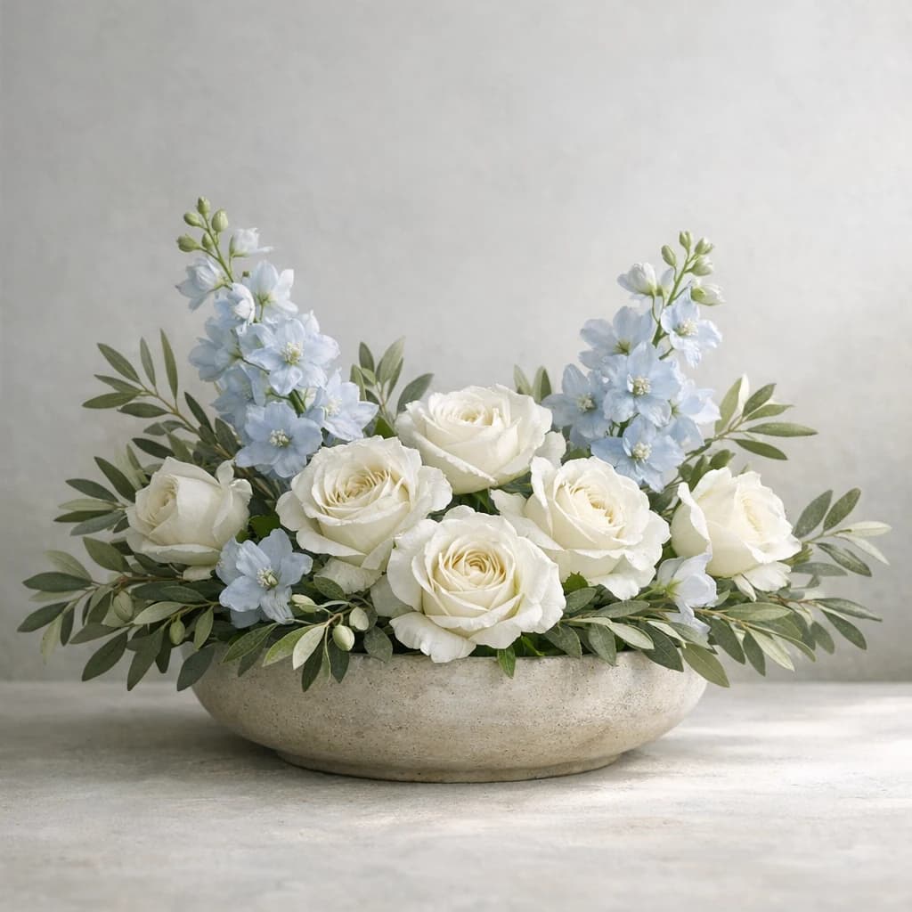 International Day of Non-Violence floral calendar still life with white roses, olive branches, pale blue delphinium