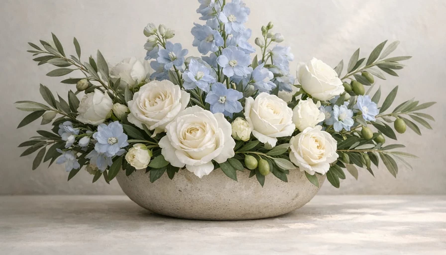International Day of Peaceful Coexistence flower guide banner featuring white roses, olive branches, pale blue delphinium in white, olive, pale blue, stone tones