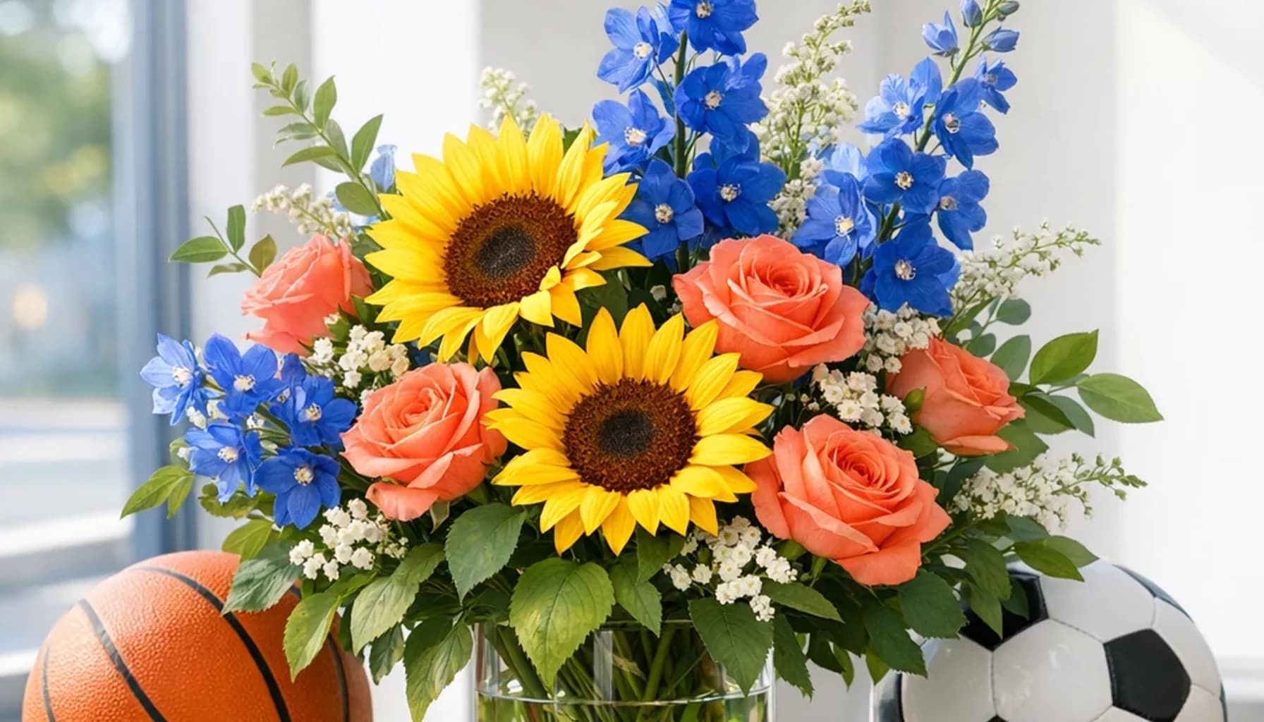 International Day of Sport for Development and Peace flower guide banner featuring sunflowers, coral roses, blue delphinium in sun, coral, blue, green tones