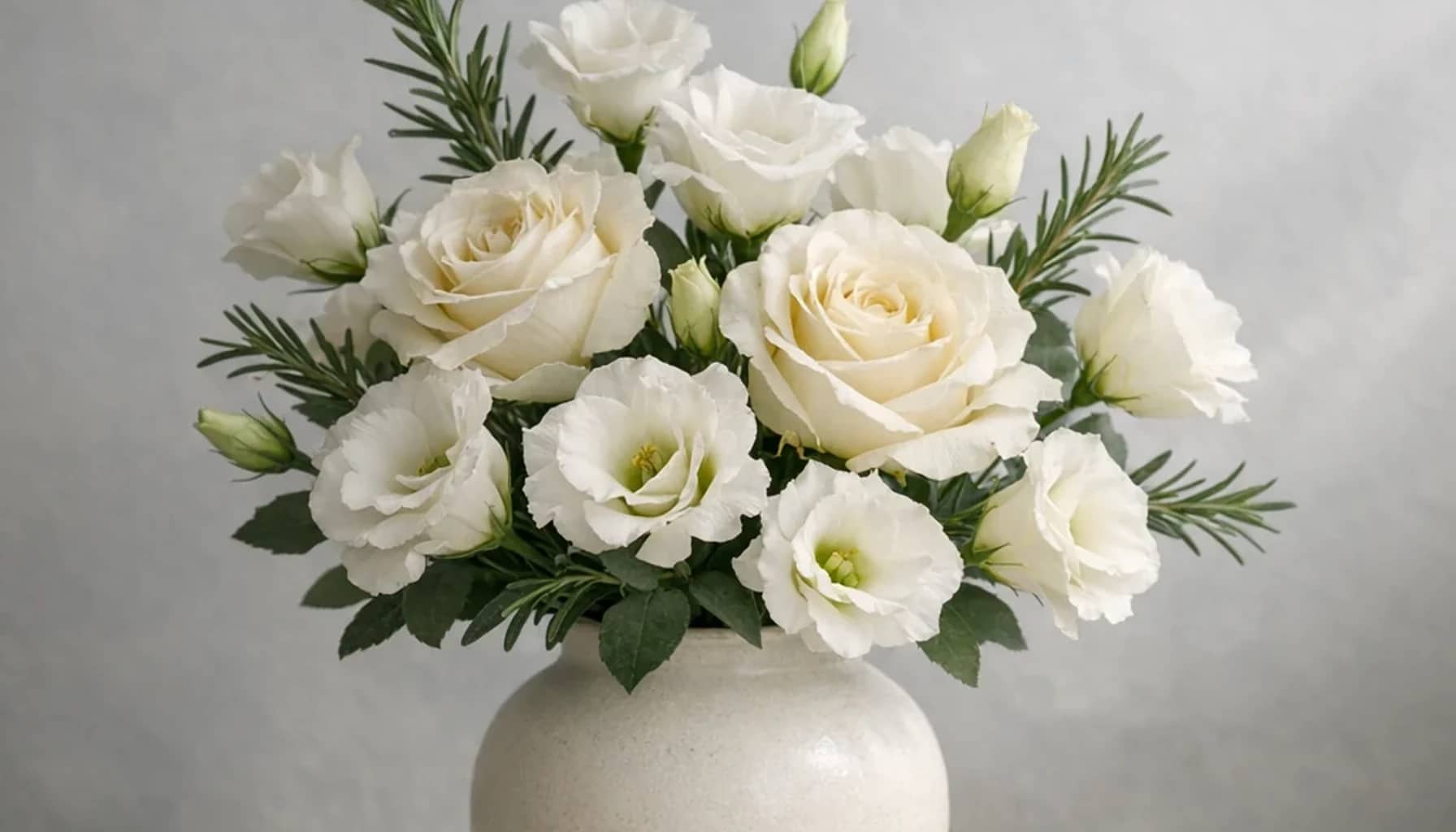 World AIDS Day flower arrangement with white lisianthus, ivory roses, rosemary designed as a respectful remembrance and reflection floral guide