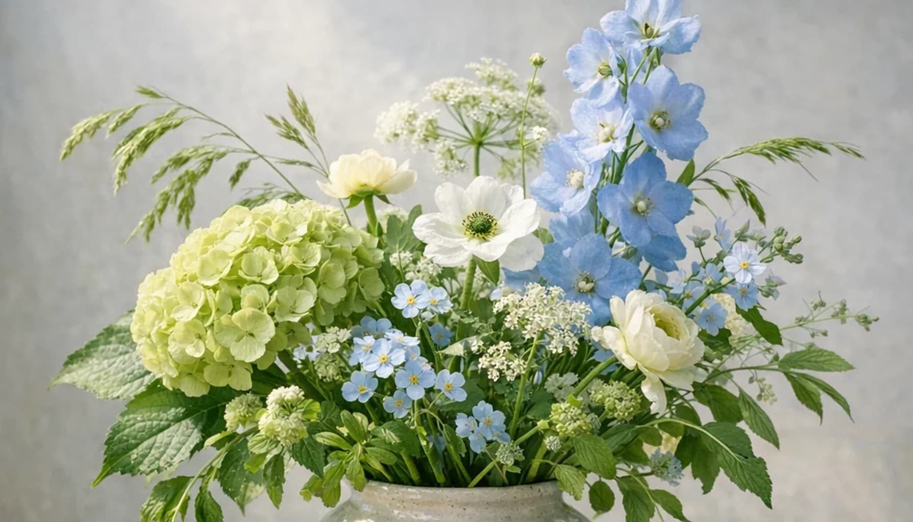 World Water Day flower guide banner featuring seasonal wildflowers, green hydrangea, textural foliage in leaf, moss, sky, clay tones