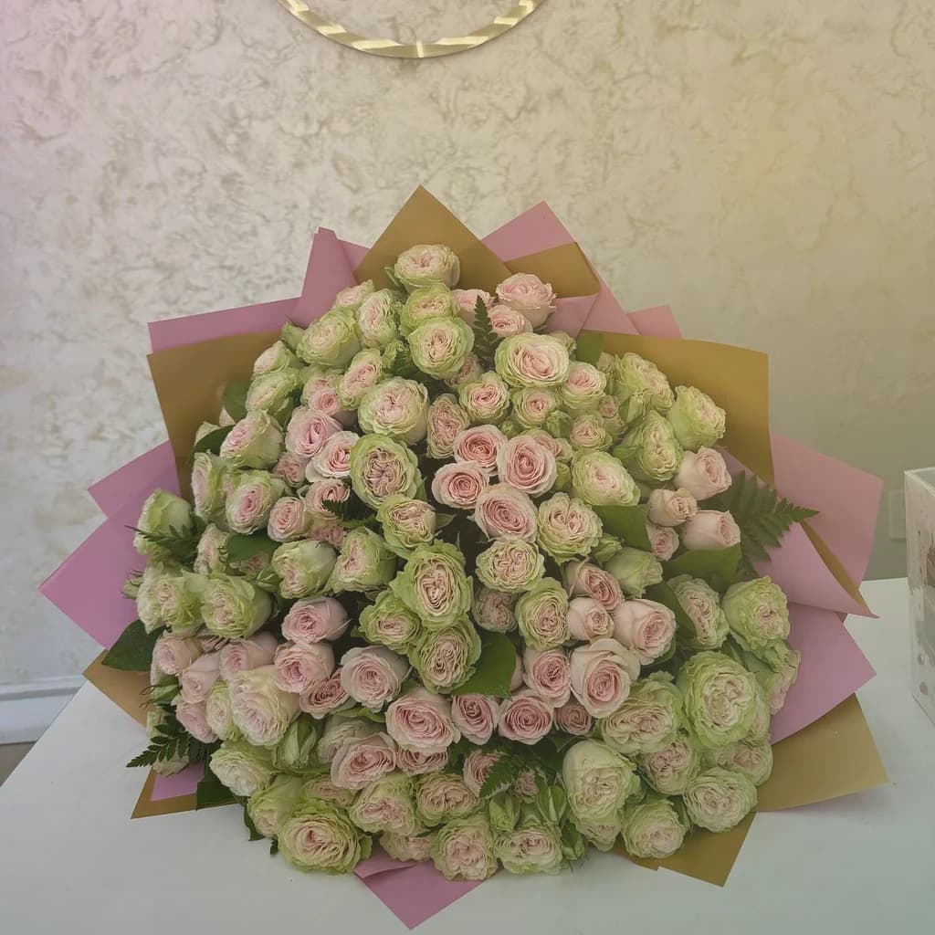 April Fools' Day flowers preview with parrot tulips, striped tulips, and ranunculus in tulip pink, sunny yellow, and spring green tones from Lina Flowers