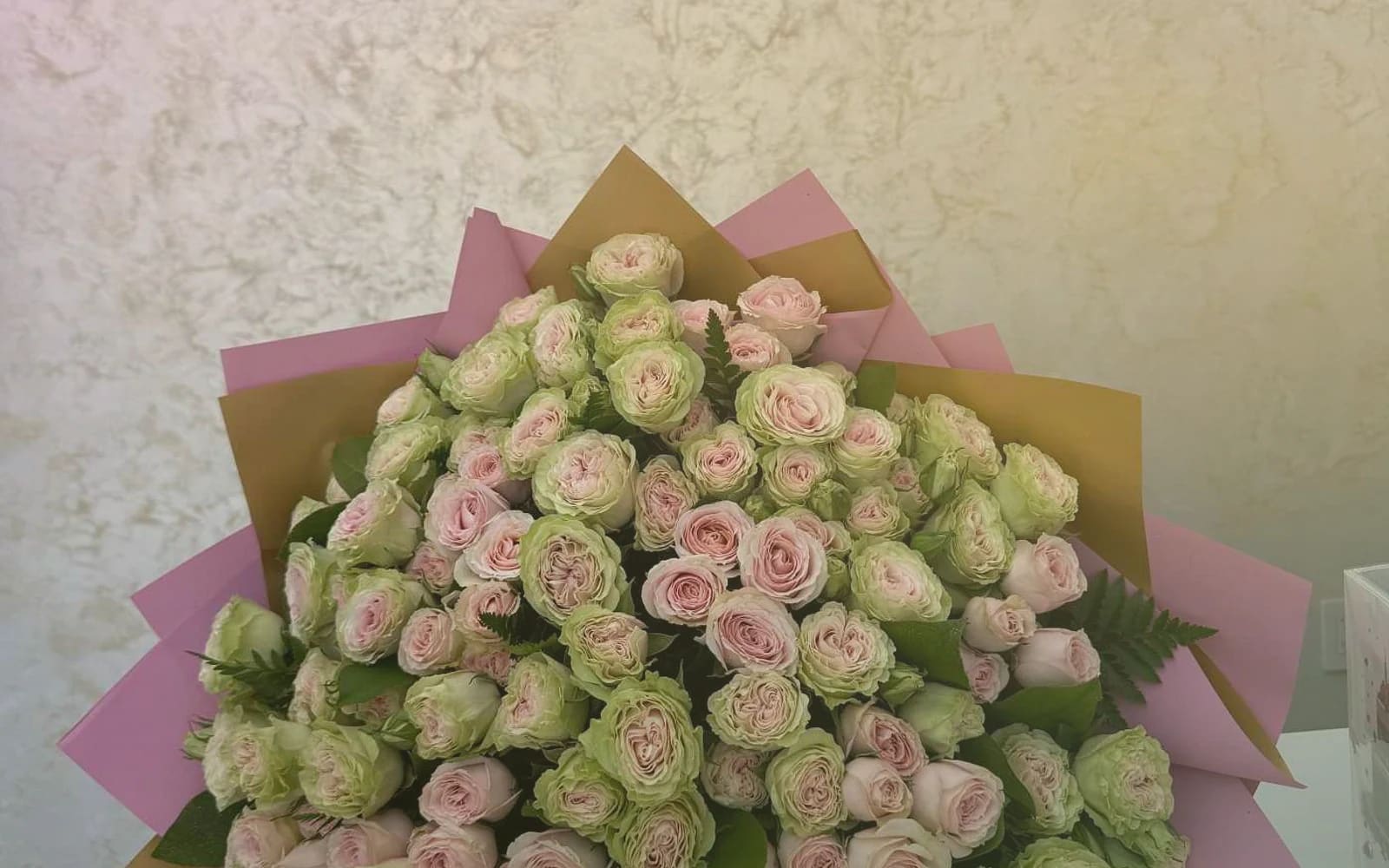 April Fools' Day flowers with parrot tulips, striped tulips, and ranunculus, tulip pink, sunny yellow, and spring green color direction, and premium playful, unexpected, joyful, and warmly surprising styling from Lina Flowers