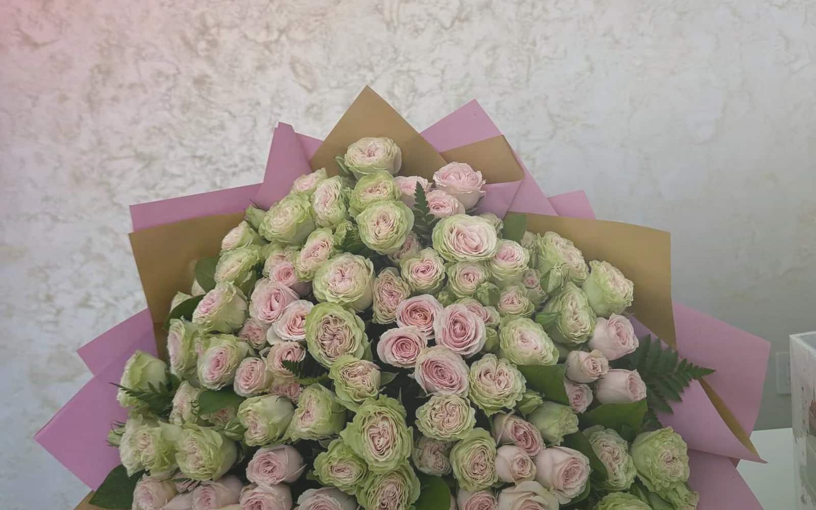 Canada Day flowers with red garden roses, white tulips, and spray roses, maple red, soft white, and garden green color direction, and premium proud, clean, warm, and quietly summer-celebratory styling from Lina Flowers