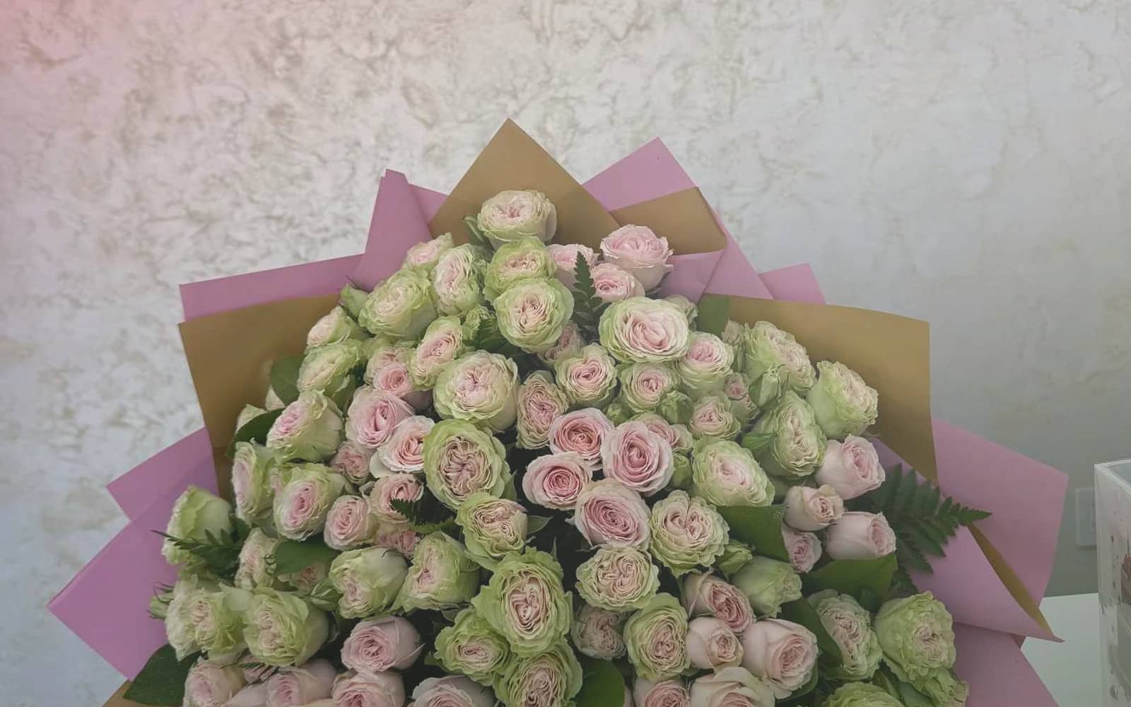 Canada Day flowers with red garden roses, white tulips, and spray roses, maple red, soft white, and garden green color direction, and premium proud, clean, warm, and quietly summer-celebratory styling from Lina Flowers