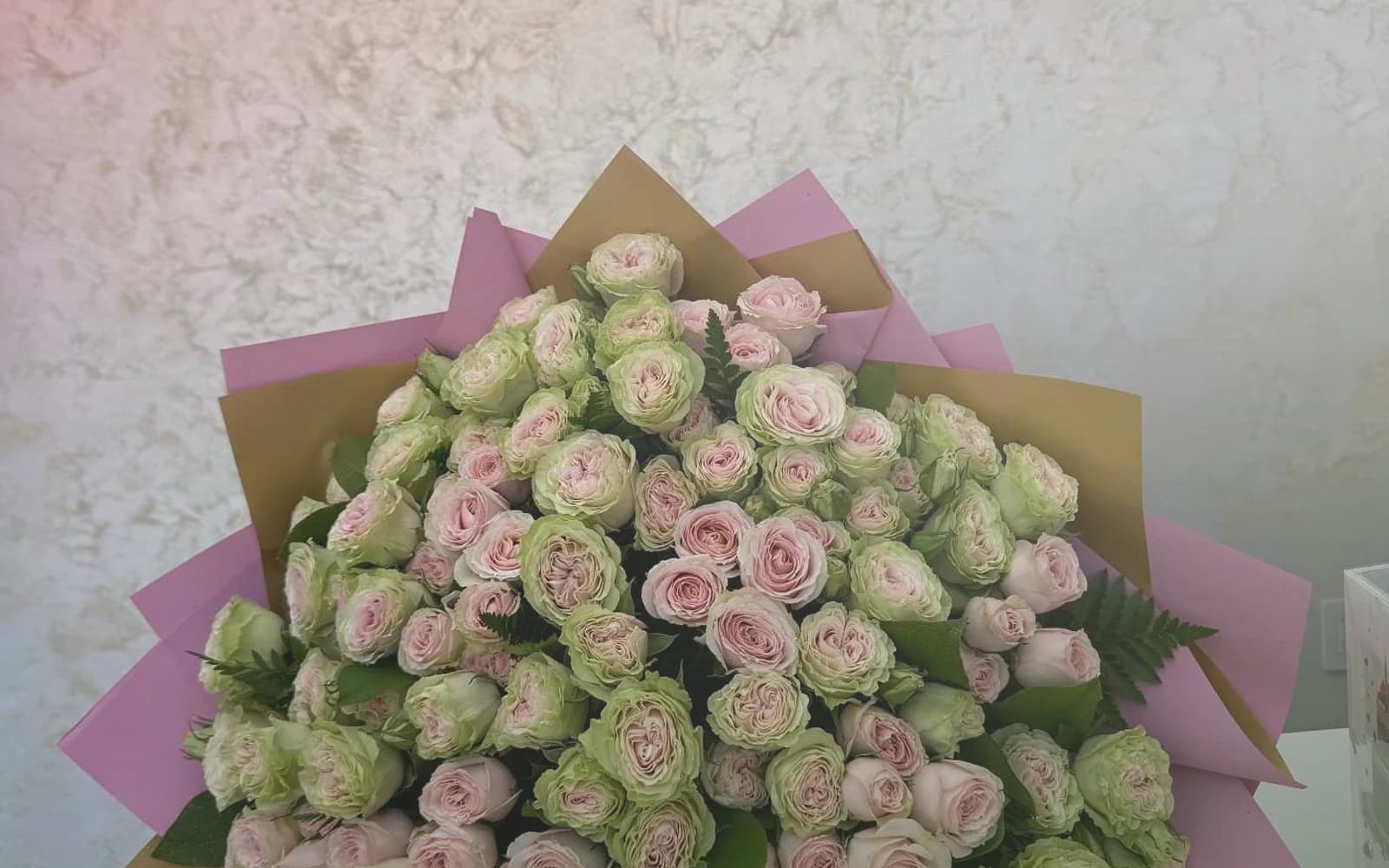 Canada Day flowers with red garden roses, white tulips, and spray roses, maple red, soft white, and garden green color direction, and premium proud, clean, warm, and quietly summer-celebratory styling from Lina Flowers