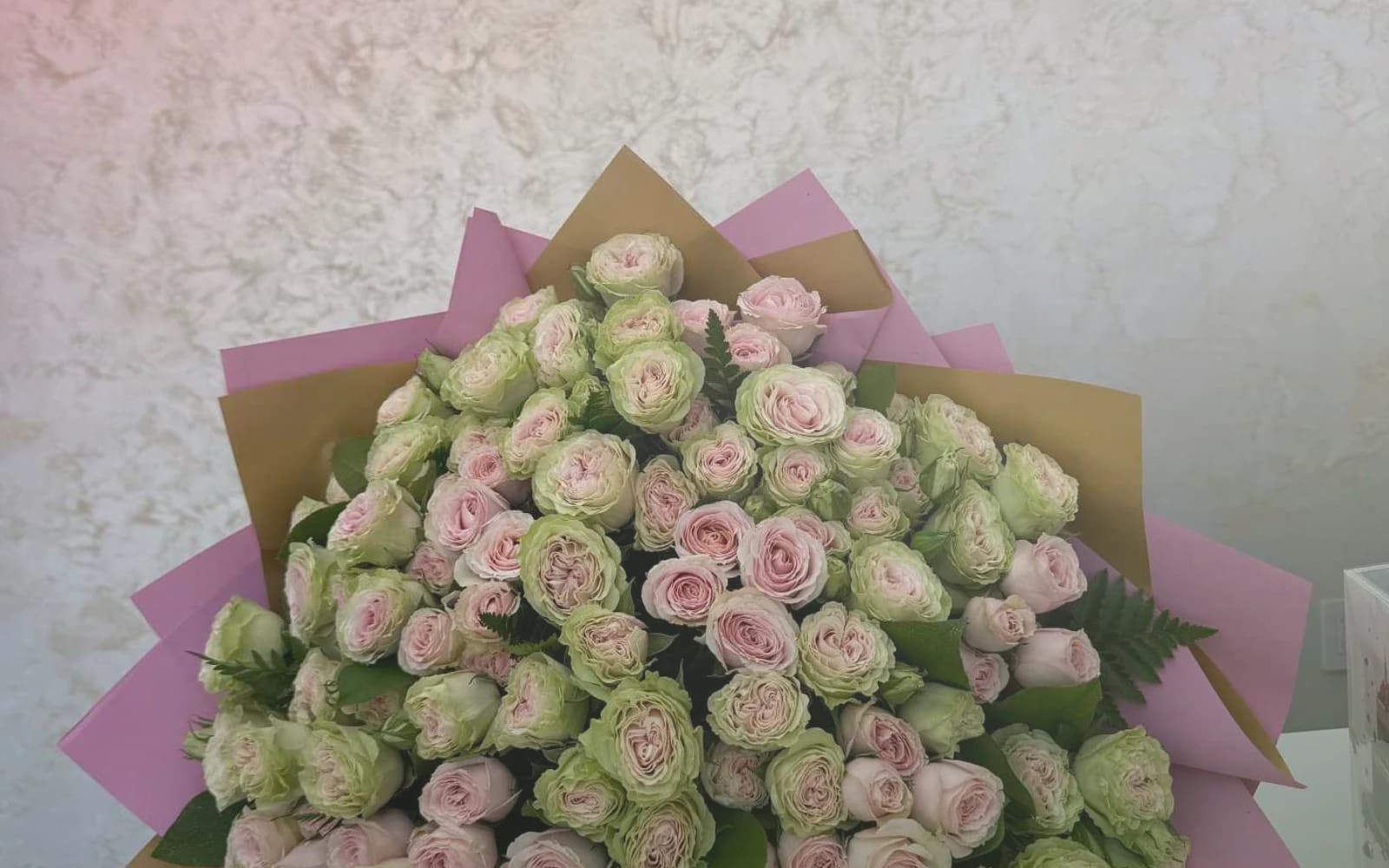 Canada Day flowers with red garden roses, white tulips, and spray roses, maple red, soft white, and garden green color direction, and premium proud, clean, warm, and quietly summer-celebratory styling from Lina Flowers