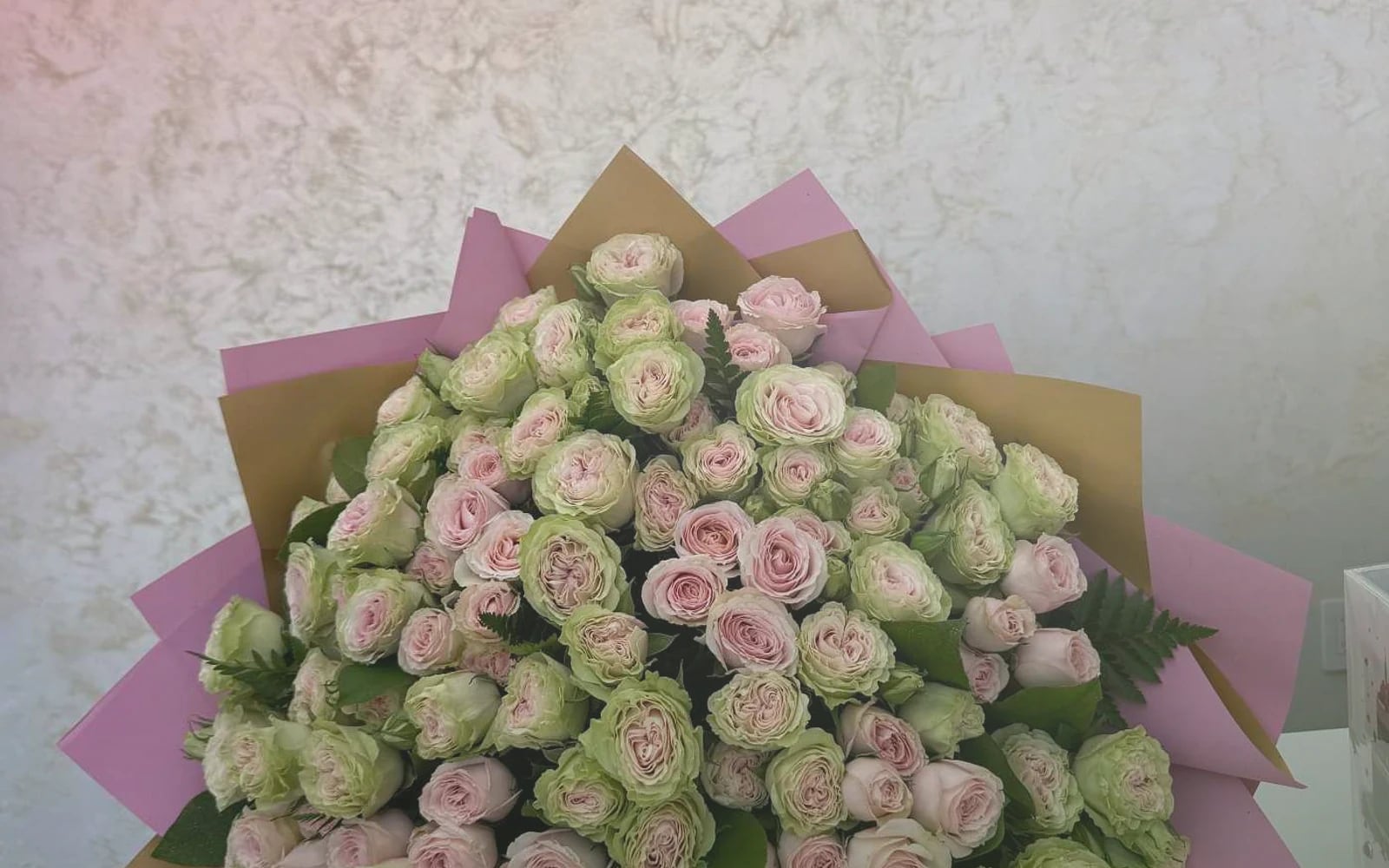 Canada Day flowers with red garden roses, white tulips, and spray roses, maple red, soft white, and garden green color direction, and premium proud, clean, warm, and quietly summer-celebratory styling from Lina Flowers