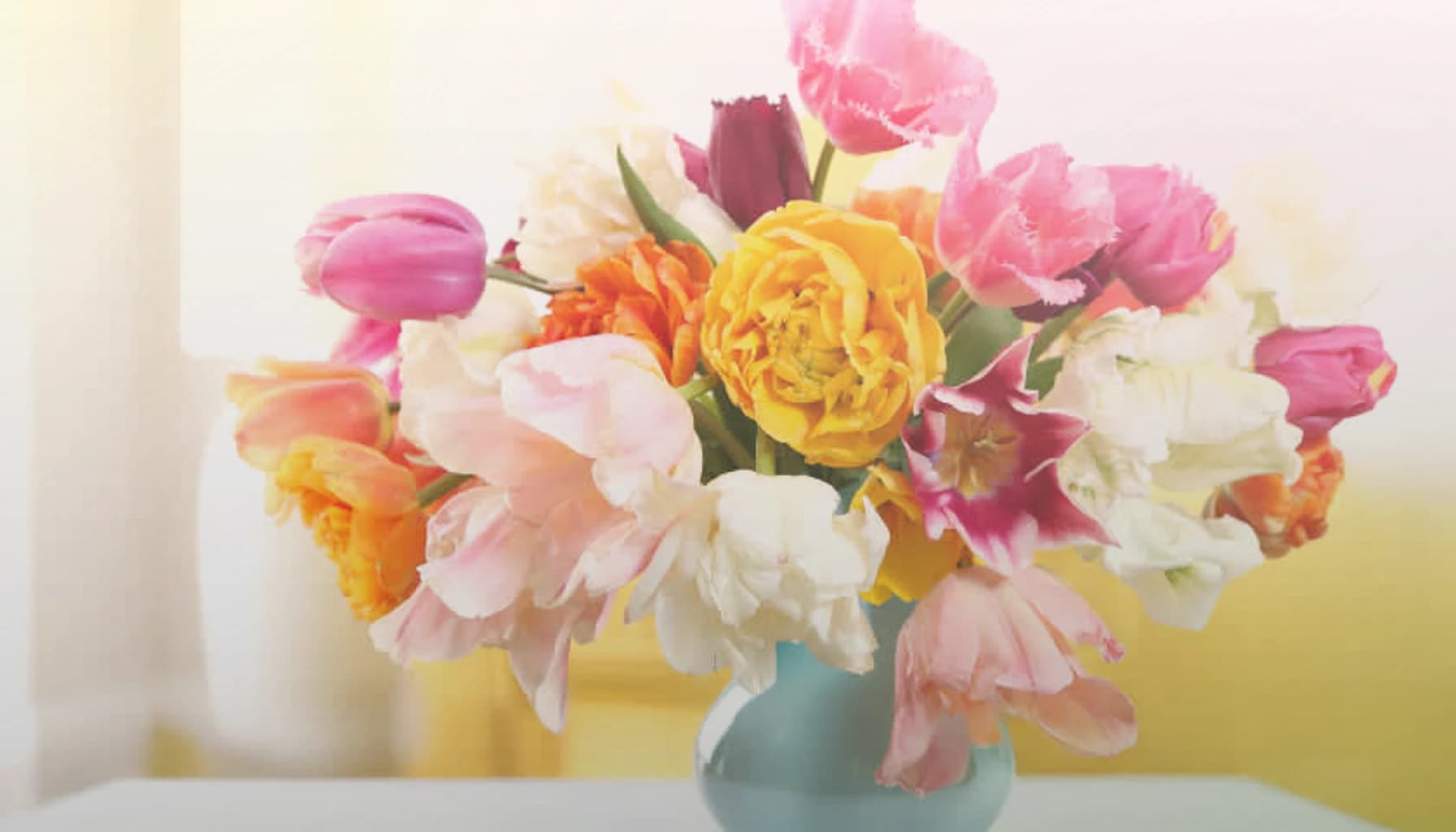 Daylight Saving Spring Forward flowers collection banner with tulips, ranunculus, and spray roses and light, airy, optimistic, and longer-day styling from Lina Flowers