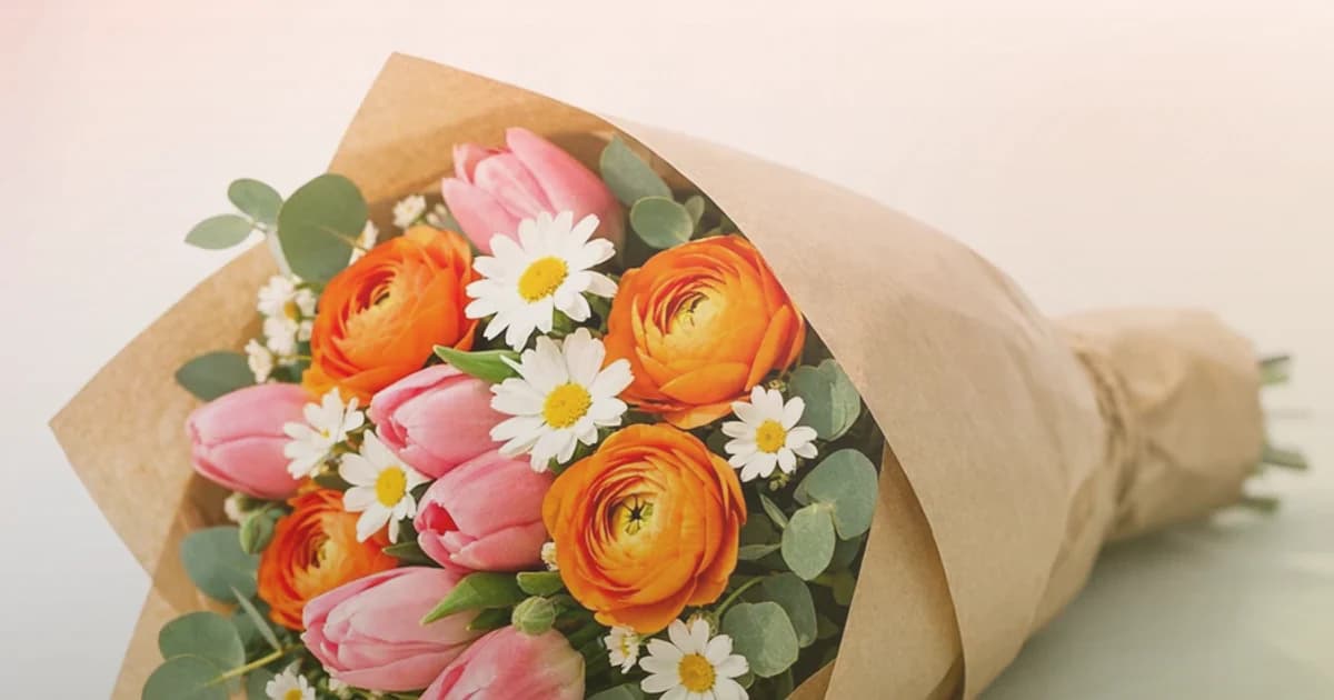 International Friendship Day flowers social share image with coral garden roses, peach ranunculus, and soft yellow tulips, coral warmth, peach bloom, and soft yellow tones, and premium Lina Flowers styling