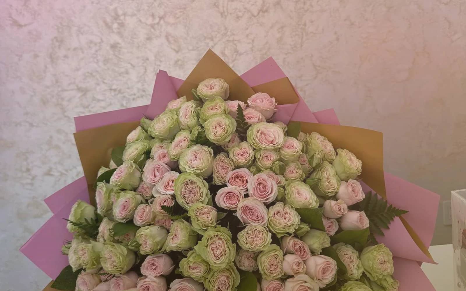 National Friendship Day flowers with pink garden roses, coral ranunculus, and sunny tulips, bright pink, coral, and sunny yellow color direction, and premium cheerful, generous, warmly summer, and friendship-led styling from Lina Flowers