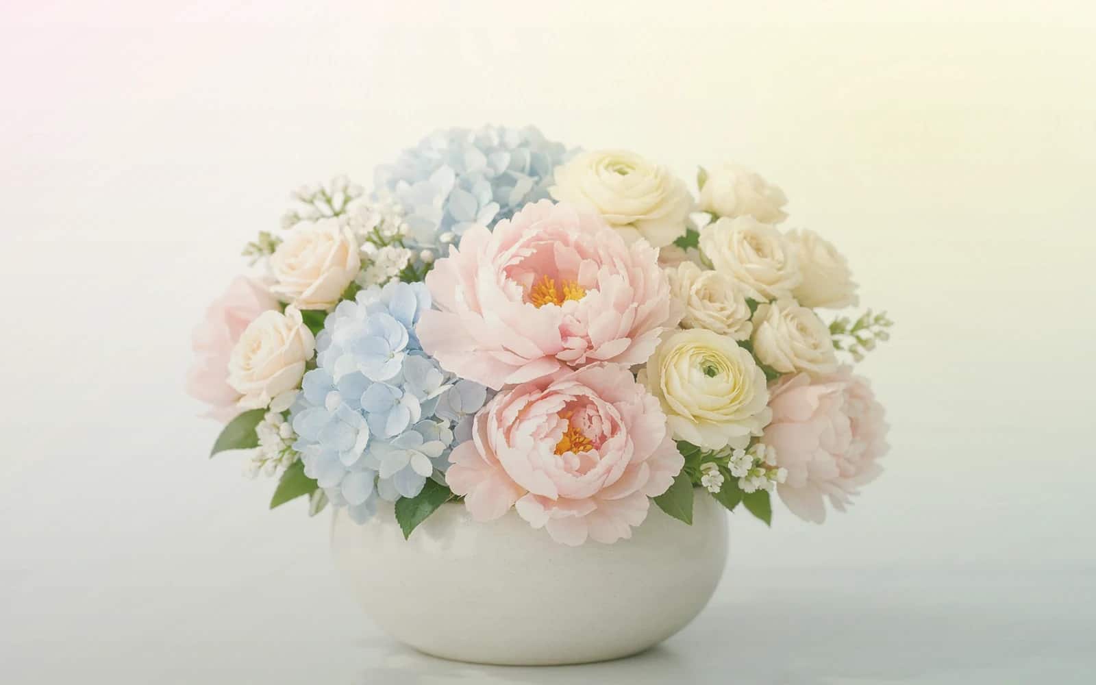 National Ice Cream Day flowers with pink ranunculus, pale yellow tulips, and spray roses, sorbet pink, pale lemon, and mint green color direction, and premium sorbet-bright, playful, light, and warmly summer styling from Lina Flowers