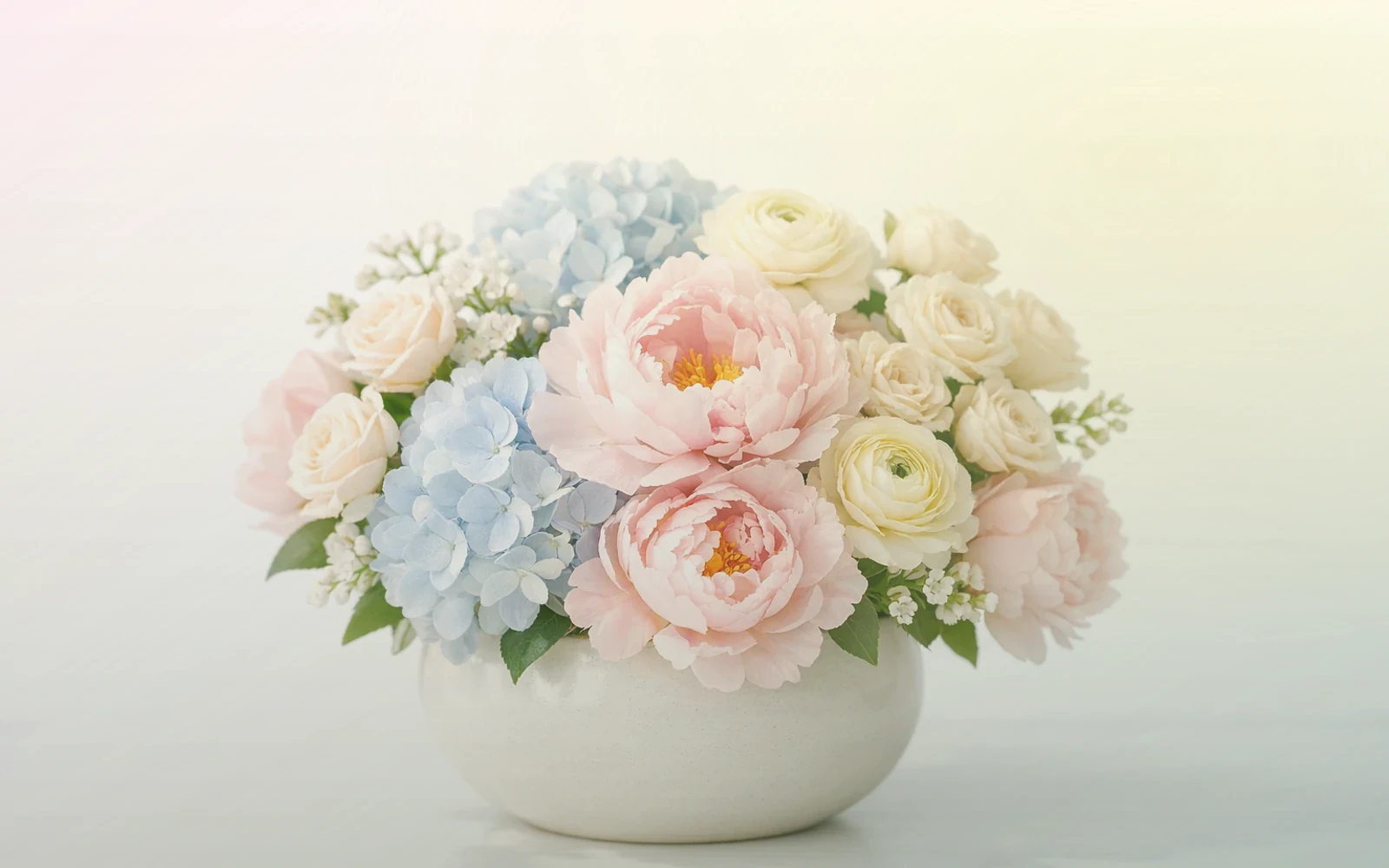 National Ice Cream Day flowers with pink ranunculus, pale yellow tulips, and spray roses, sorbet pink, pale lemon, and mint green color direction, and premium sorbet-bright, playful, light, and warmly summer styling from Lina Flowers
