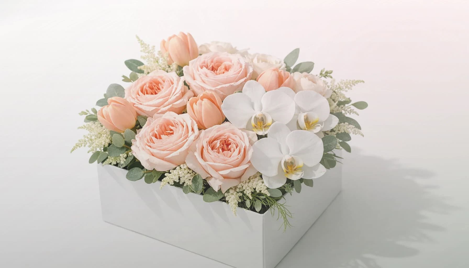 Nurses Day flowers collection banner with white roses, blush tulips, and ranunculus and calm, restorative, sincere, and quietly thankful styling from Lina Flowers