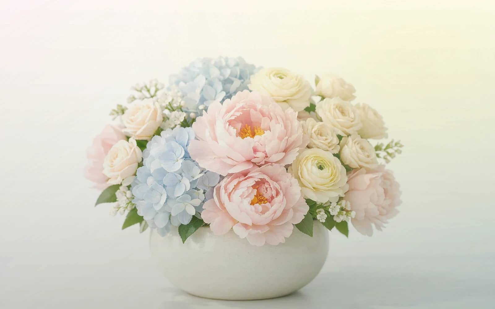 Read Across America Day flowers with pink ranunculus, pale yellow tulips, and spray roses, soft pink, pale lemon, and fresh mint color direction, and premium cheerful, approachable, classroom-friendly, and warmly playful styling from Lina Flowers