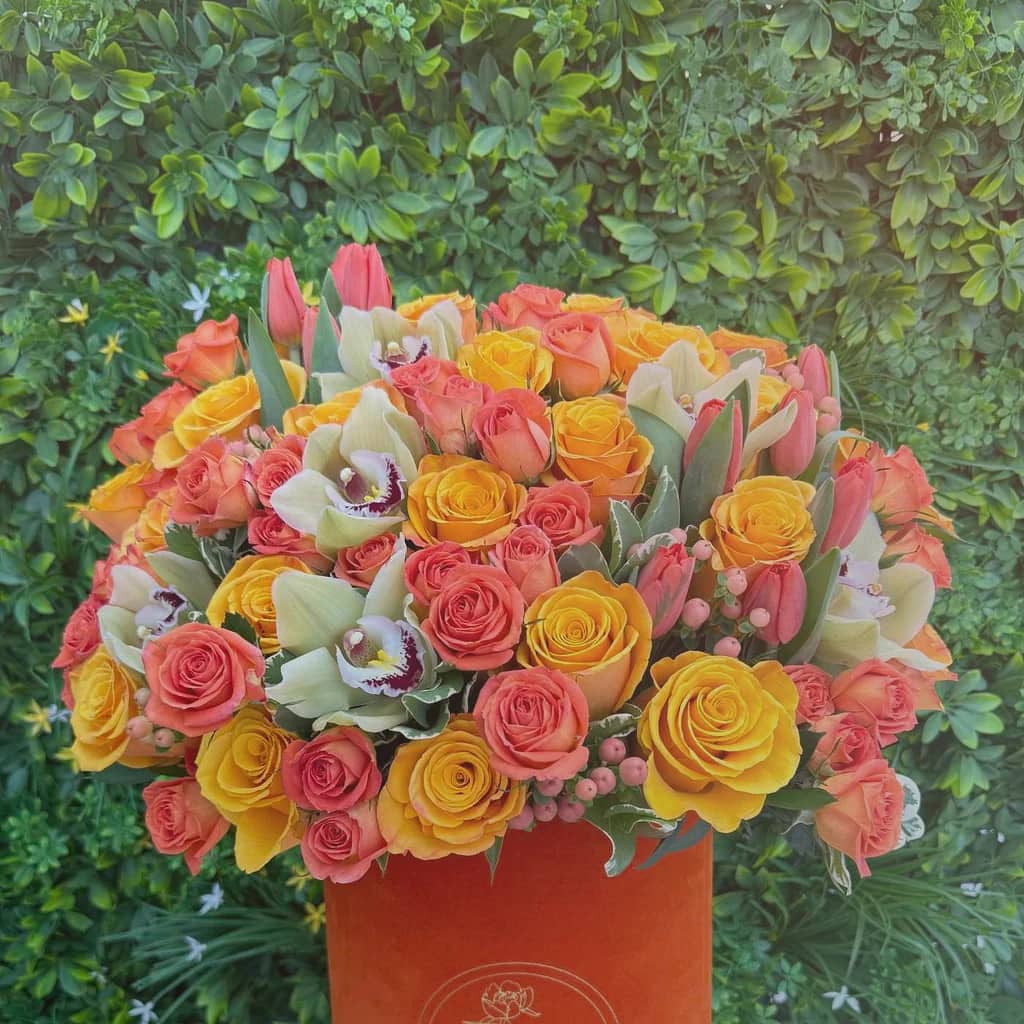 Sweetest Day flowers preview with blush garden roses, terracotta ranunculus, and cream tulips in deep blush, terracotta, and soft cream tones from Lina Flowers
