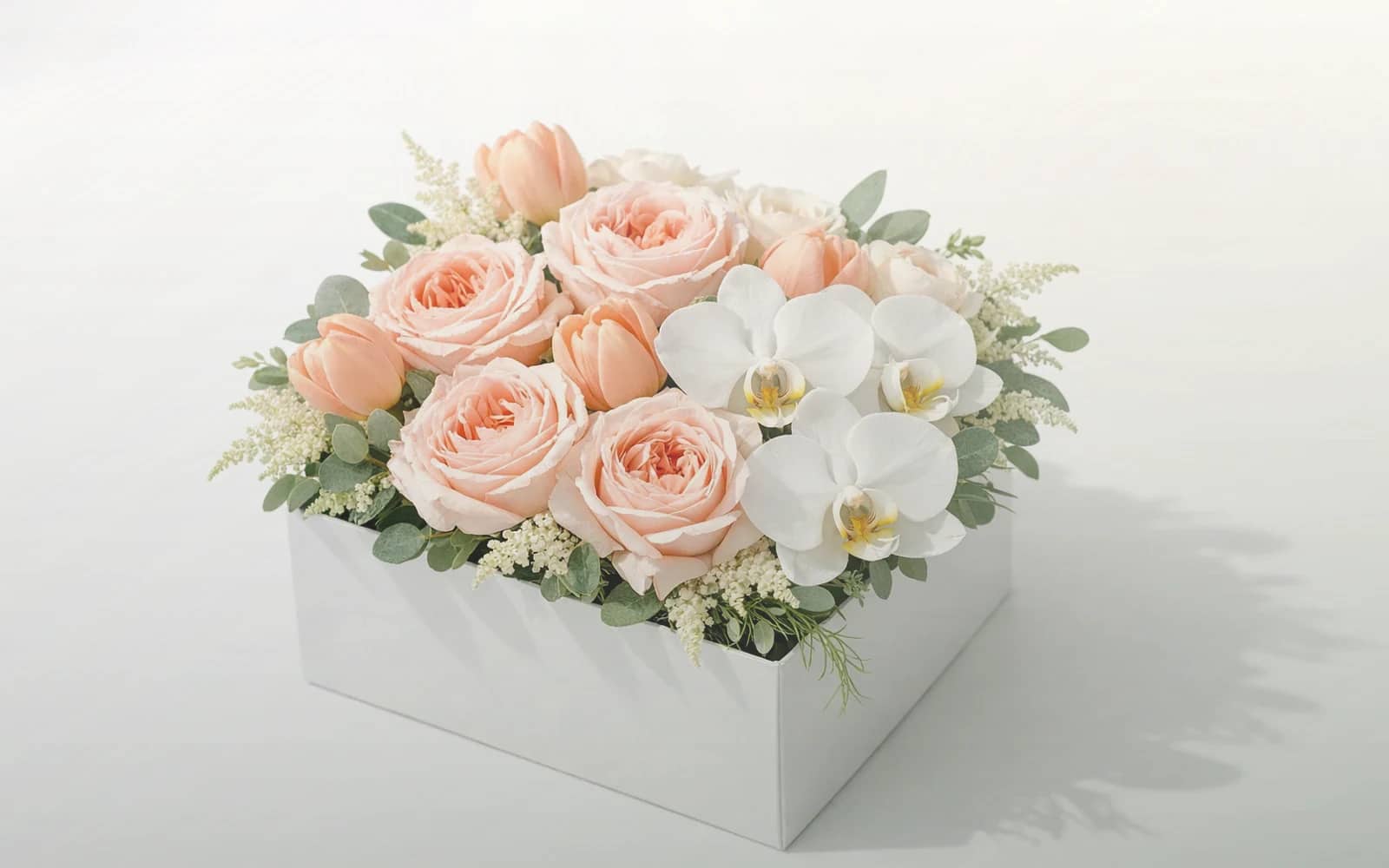 Tax Day flowers with white tulips, cream roses, and fresh greens, soft white, cream, and sage green color direction, and premium sincere, restrained, professional, and quietly grateful styling from Lina Flowers