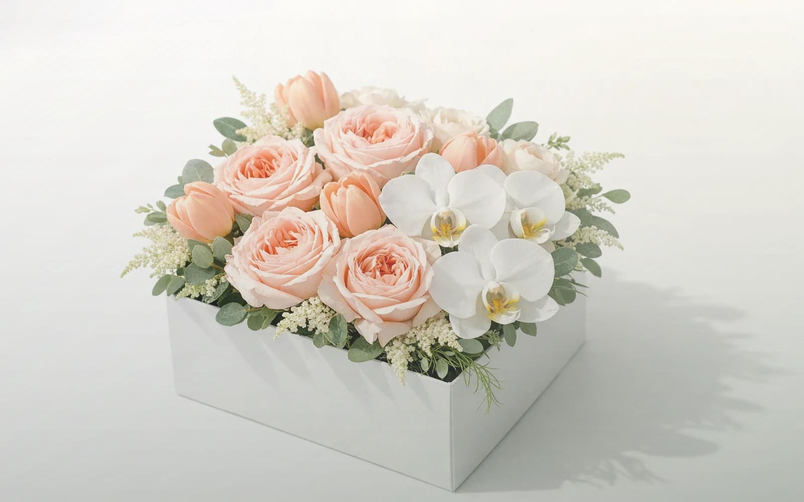 Tax Day flowers with white tulips, cream roses, and fresh greens, soft white, cream, and sage green color direction, and premium sincere, restrained, professional, and quietly grateful styling from Lina Flowers