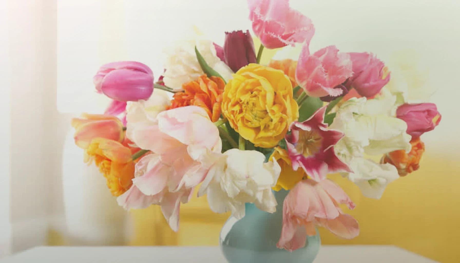 Tu BiShvat flowers collection banner with flowering quince, almond branches, and soft pink ranunculus and renewing, branch-led, soft, and rooted styling from Lina Flowers
