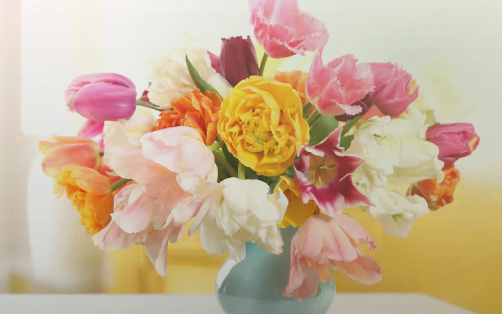 Tu BiShvat flowers with flowering quince, almond branches, and soft pink ranunculus, almond blossom, olive branch, and warm honey color direction, and premium renewing, branch-led, soft, and rooted styling from Lina Flowers