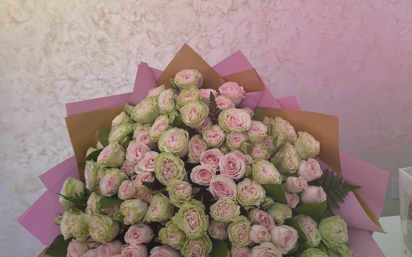 World Emoji Day flowers with sunflowers, yellow tulips, and hot-pink ranunculus, sunny yellow, hot pink, and spring green color direction, and premium cheerful, playful, sunny, and feel-good styling from Lina Flowers