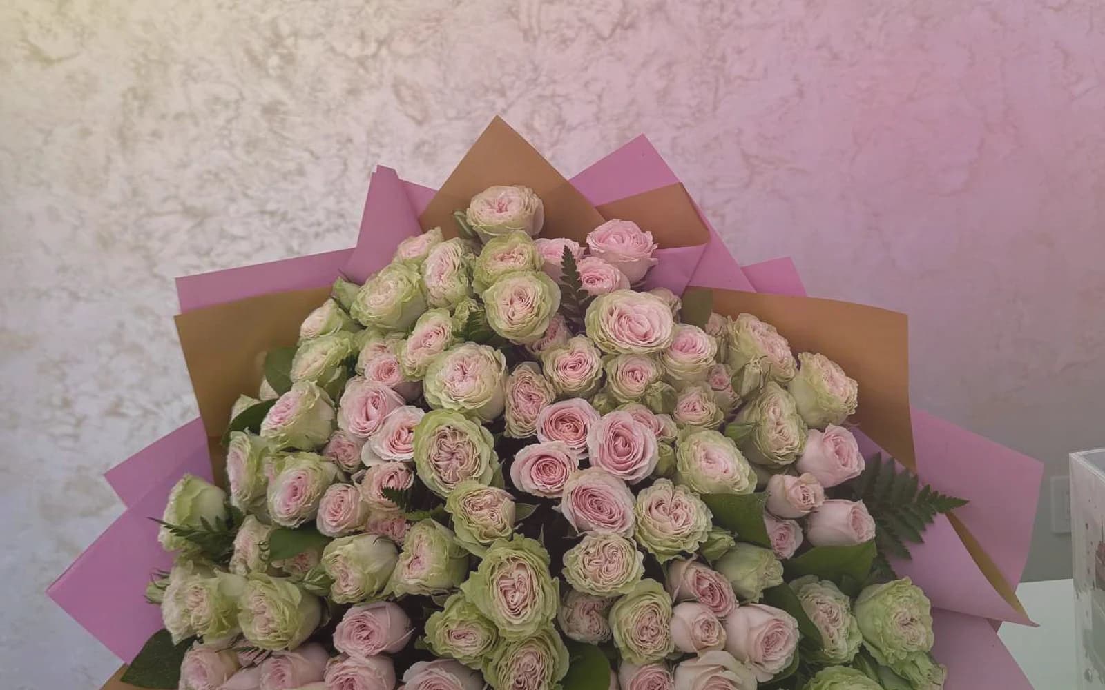 World Emoji Day flowers with sunflowers, yellow tulips, and hot-pink ranunculus, sunny yellow, hot pink, and spring green color direction, and premium cheerful, playful, sunny, and feel-good styling from Lina Flowers