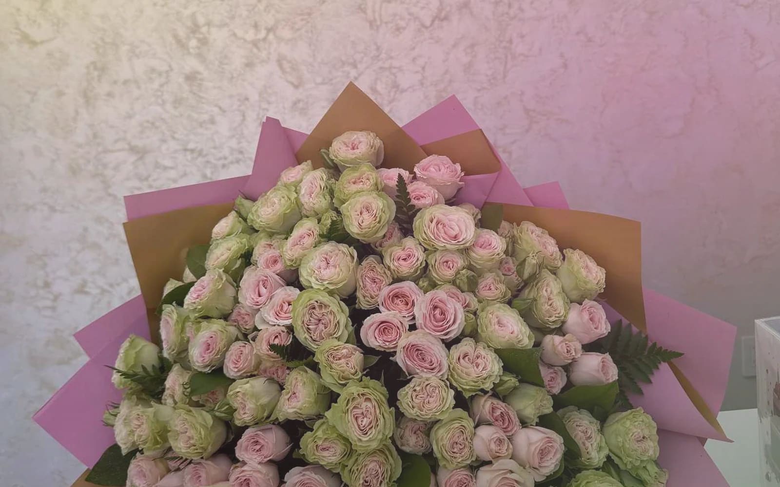 World Emoji Day flowers with sunflowers, yellow tulips, and hot-pink ranunculus, sunny yellow, hot pink, and spring green color direction, and premium cheerful, playful, sunny, and feel-good styling from Lina Flowers