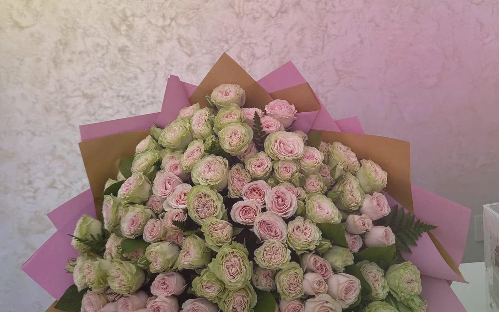 World Emoji Day flowers with sunflowers, yellow tulips, and hot-pink ranunculus, sunny yellow, hot pink, and spring green color direction, and premium cheerful, playful, sunny, and feel-good styling from Lina Flowers
