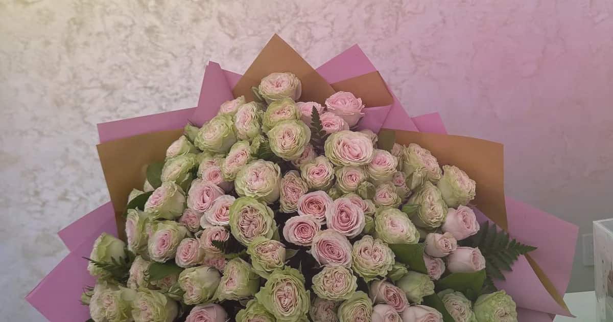 World Emoji Day flowers social share image with sunflowers, yellow tulips, and hot-pink ranunculus, sunny yellow, hot pink, and spring green tones, and premium Lina Flowers styling