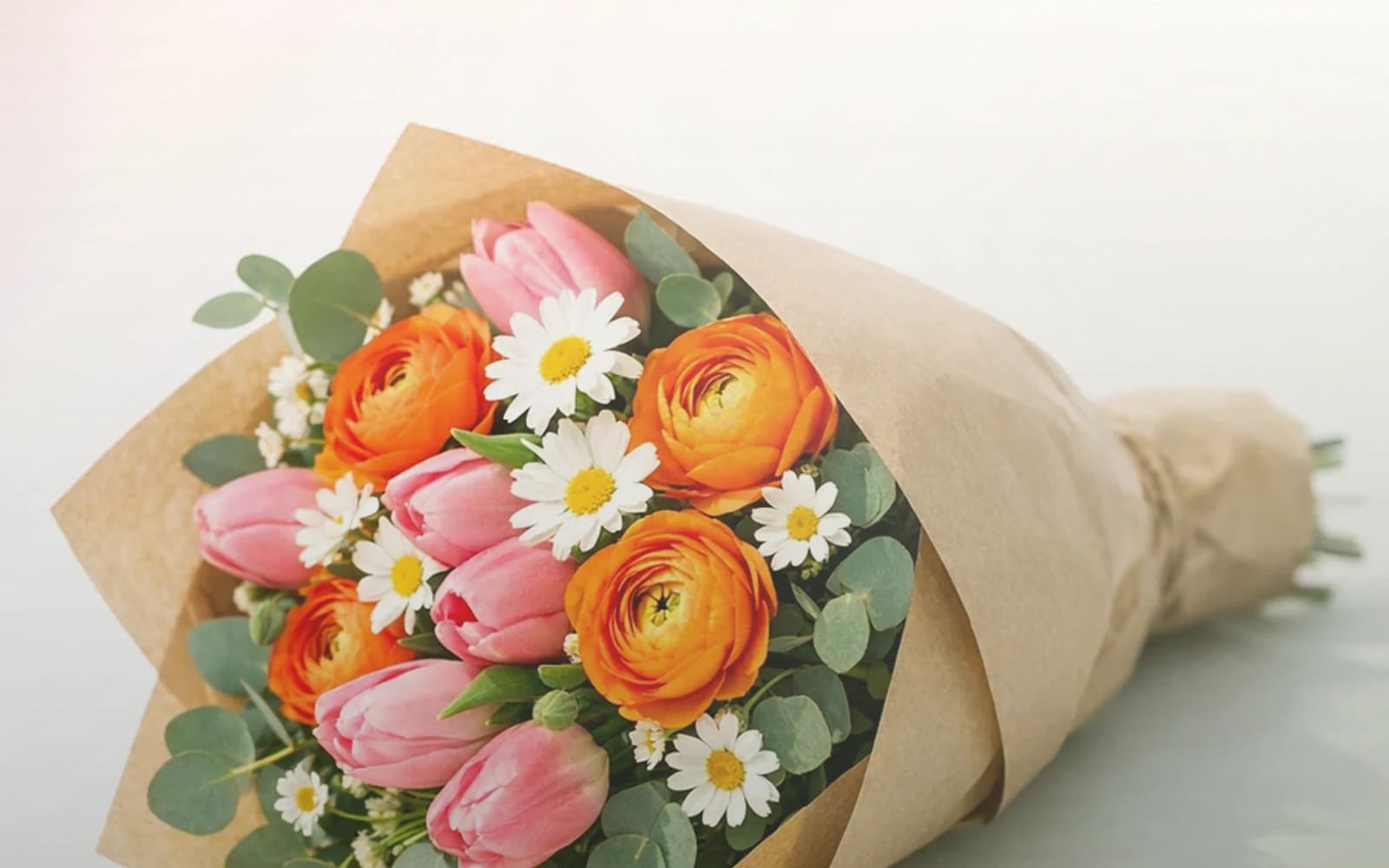 World Kindness Day flowers with peach garden roses, cream ranunculus, and sage eucalyptus, warm peach, soft cream, and sage green color direction, and premium warm, generous, easy, and quietly kind styling from Lina Flowers