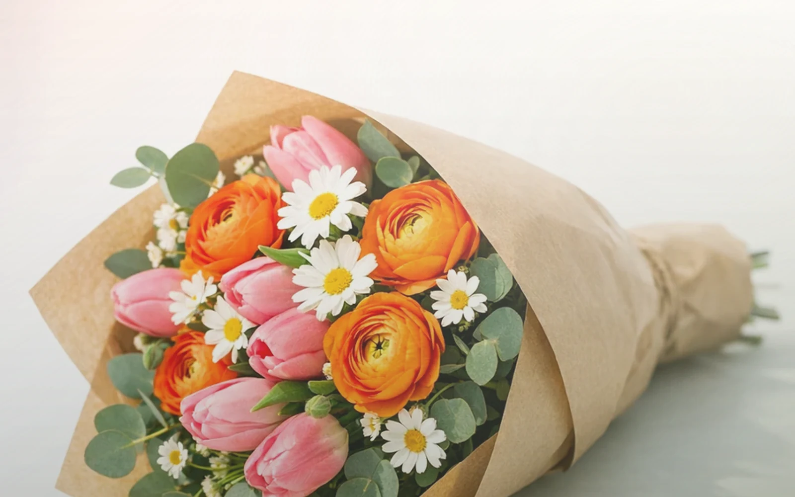 World Kindness Day flowers with peach garden roses, cream ranunculus, and sage eucalyptus, warm peach, soft cream, and sage green color direction, and premium warm, generous, easy, and quietly kind styling from Lina Flowers