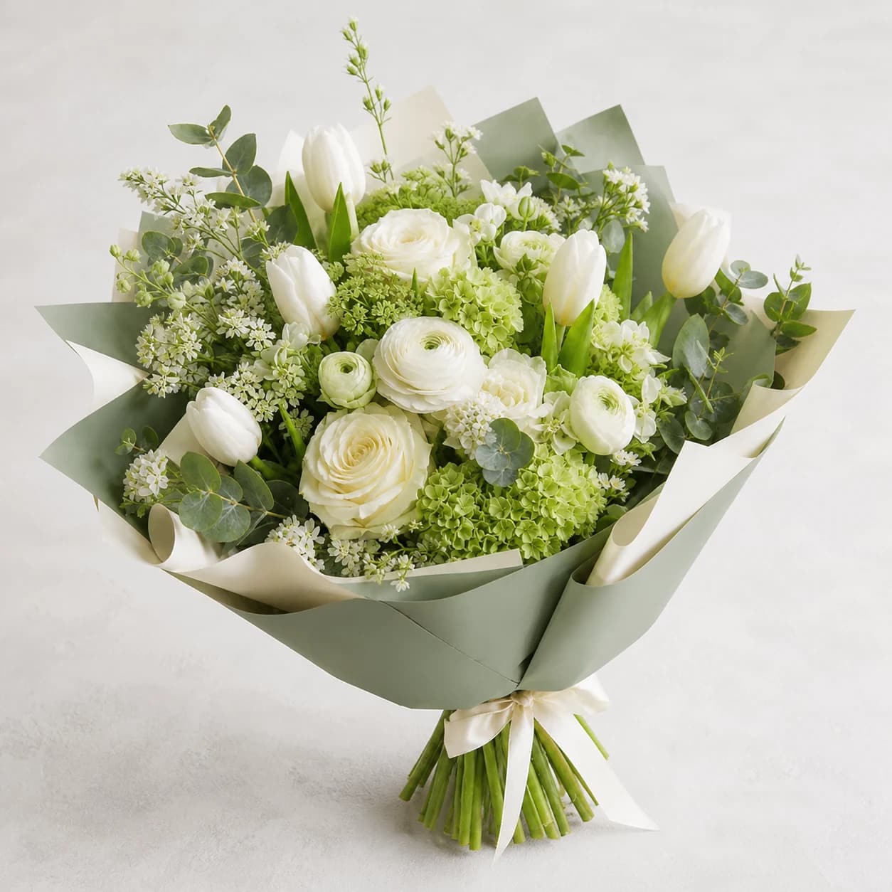 Fresh Start AI-assisted studio view of the hand-wrapped bouquet in white, ivory, fresh green, and muted sage