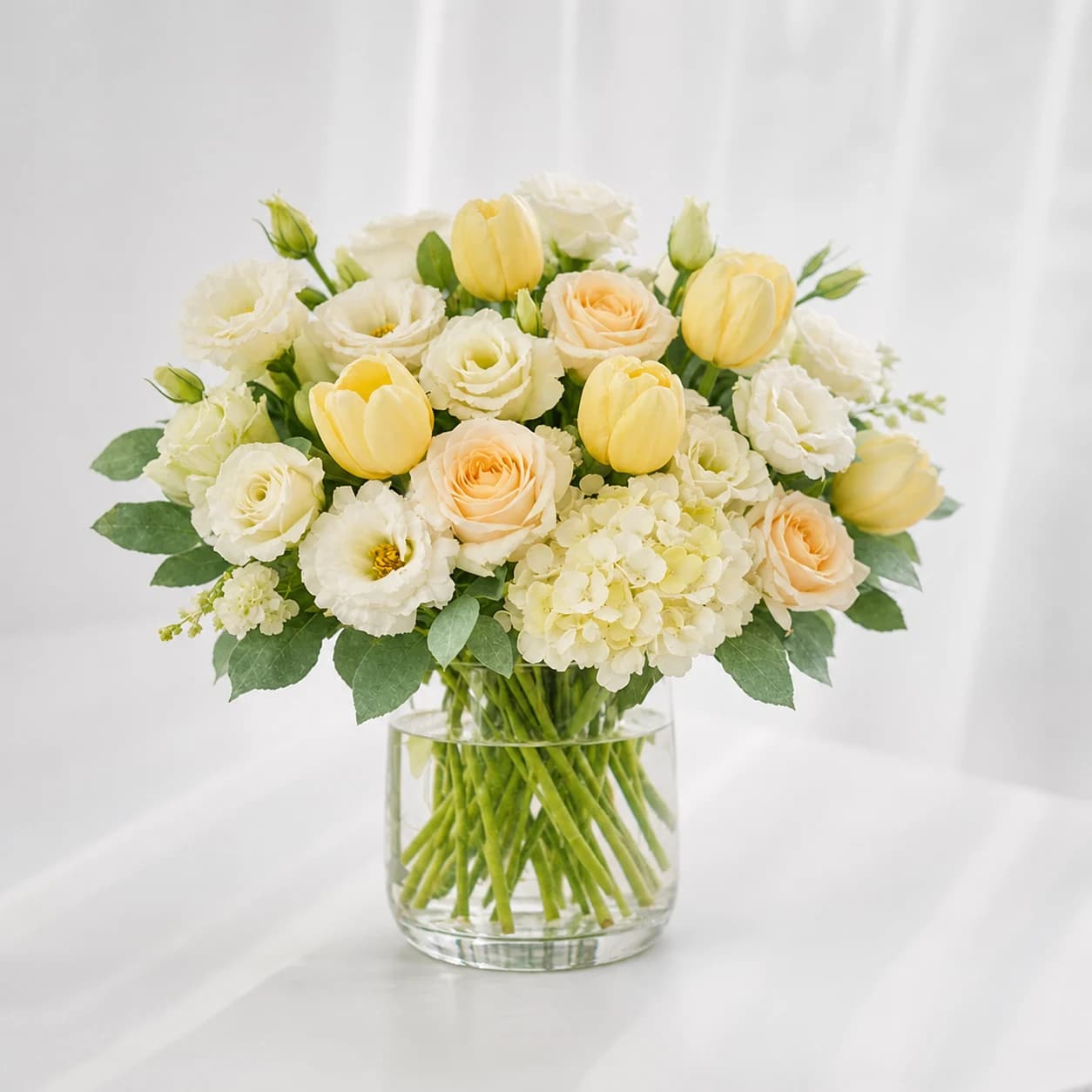Healing Sunshine AI-assisted studio view of the hand-wrapped bouquet in soft yellow, peach, white, and fresh green