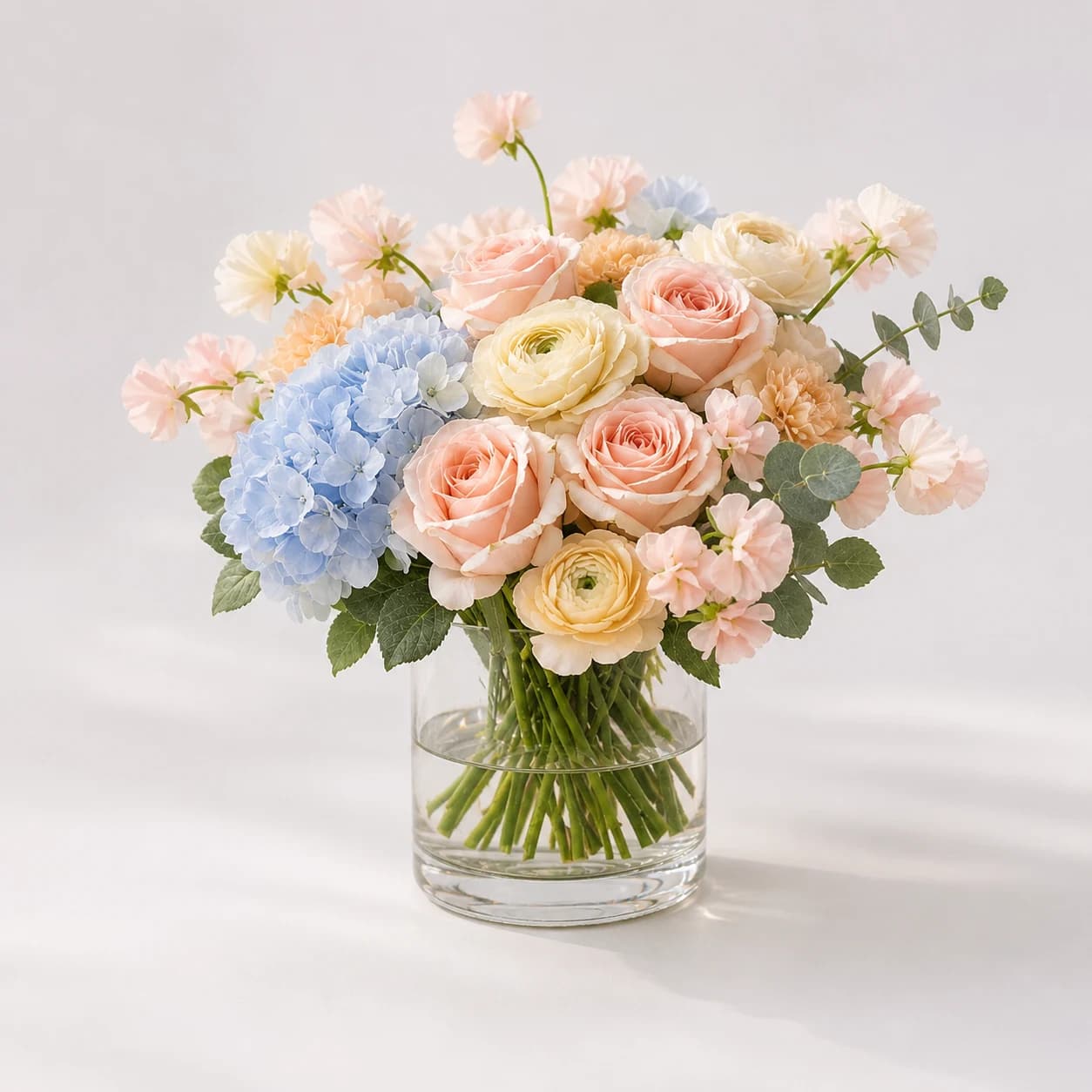 Welcome Baby Blush AI-assisted studio view of the modern flower box in blush, cream, pale yellow, and sage