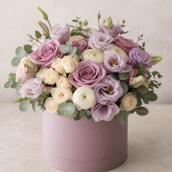 Lavender Hour lilac roses, lisianthus, ranunculus, and eucalyptus in a dusty mauve flower box